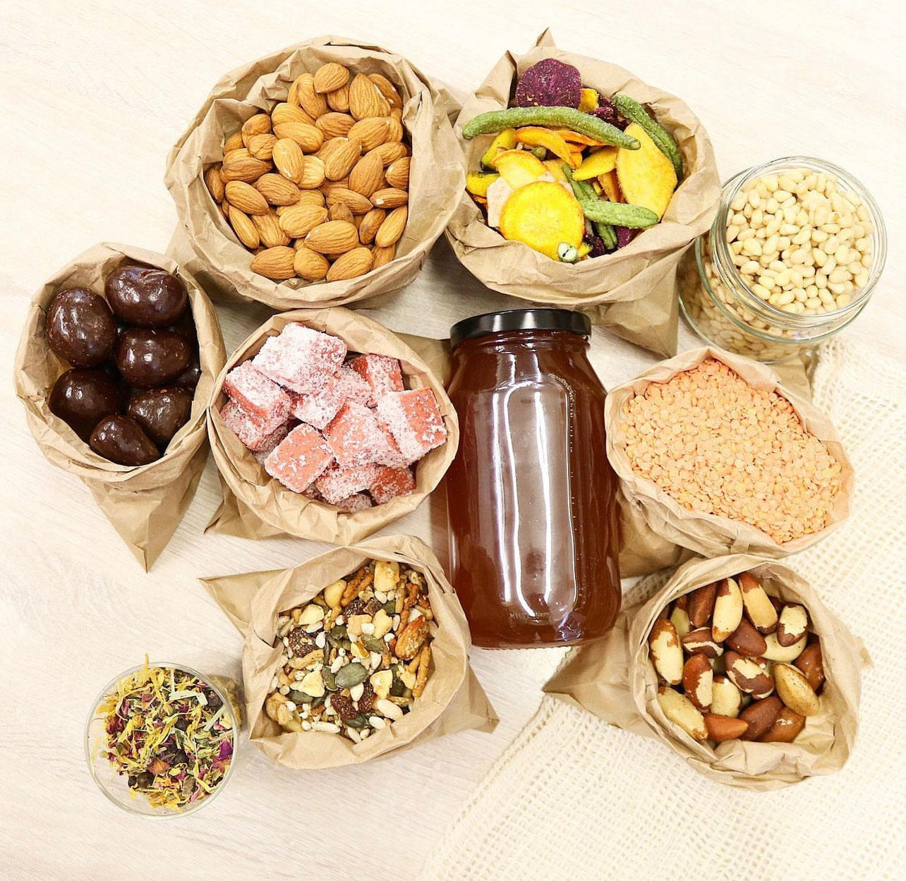 Organic mixed snacks & pantry staples | almonds, brazil nuts, dried fruits, honey jar, lentils & healthy treats