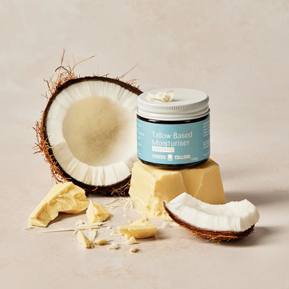 Jar of Tallow-Based Moisturizer with coconut and tallow on a neutral background